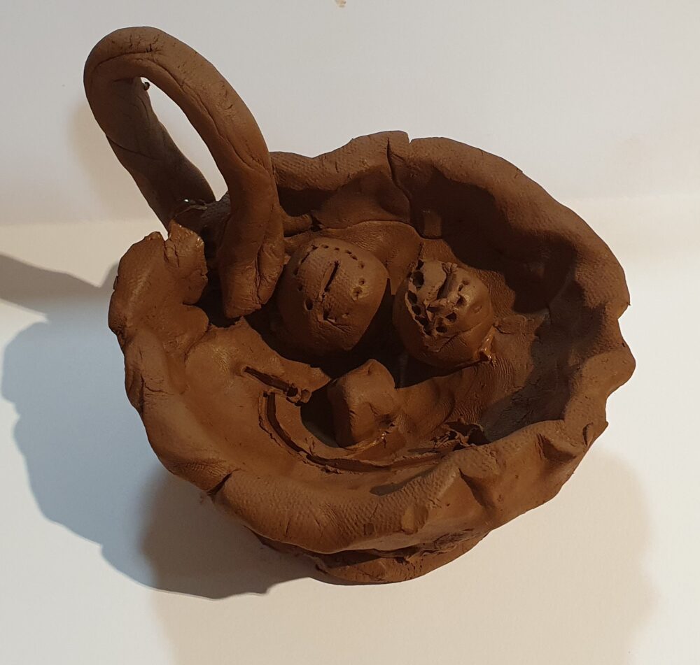 A student's clay cup in the style of an ancient Greek Kyathos
