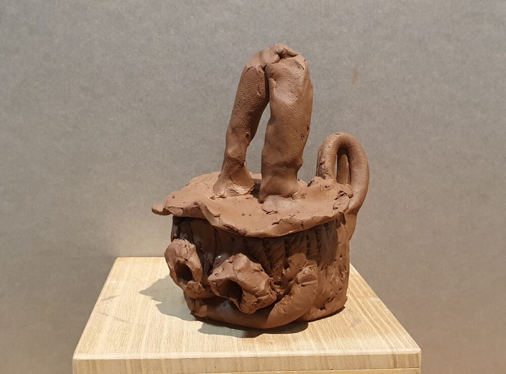 A student's clay cup in the style of an ancient Greek Kyathos