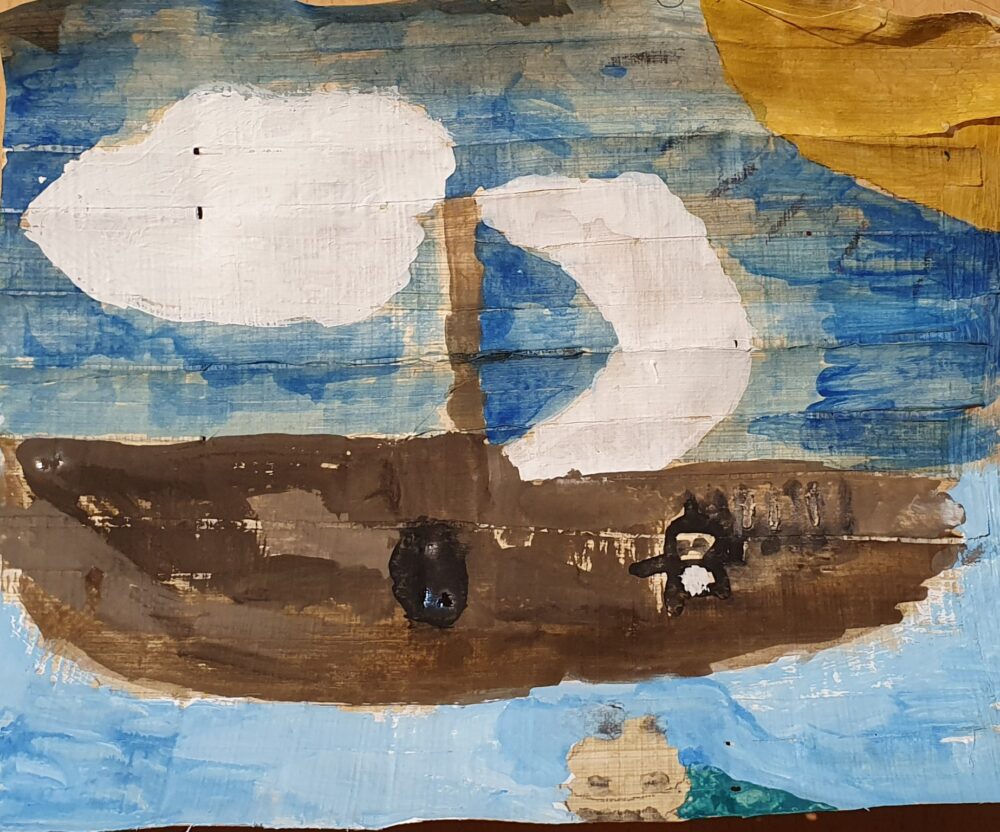 A student's papyrus painting of a boat on the Nile.